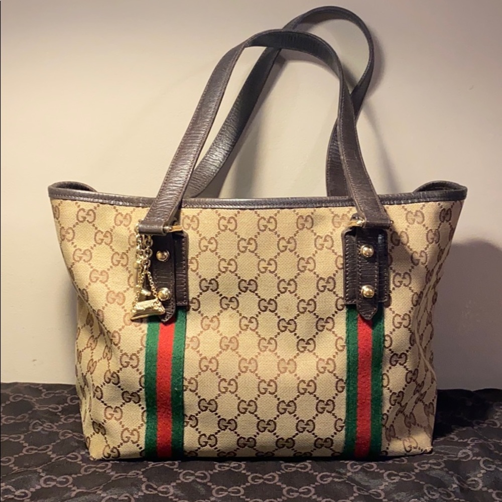 Authentic Gucci canvas tote bag with gold charms